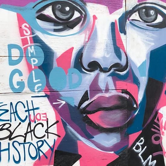 Painted mural that reads Teach Black History