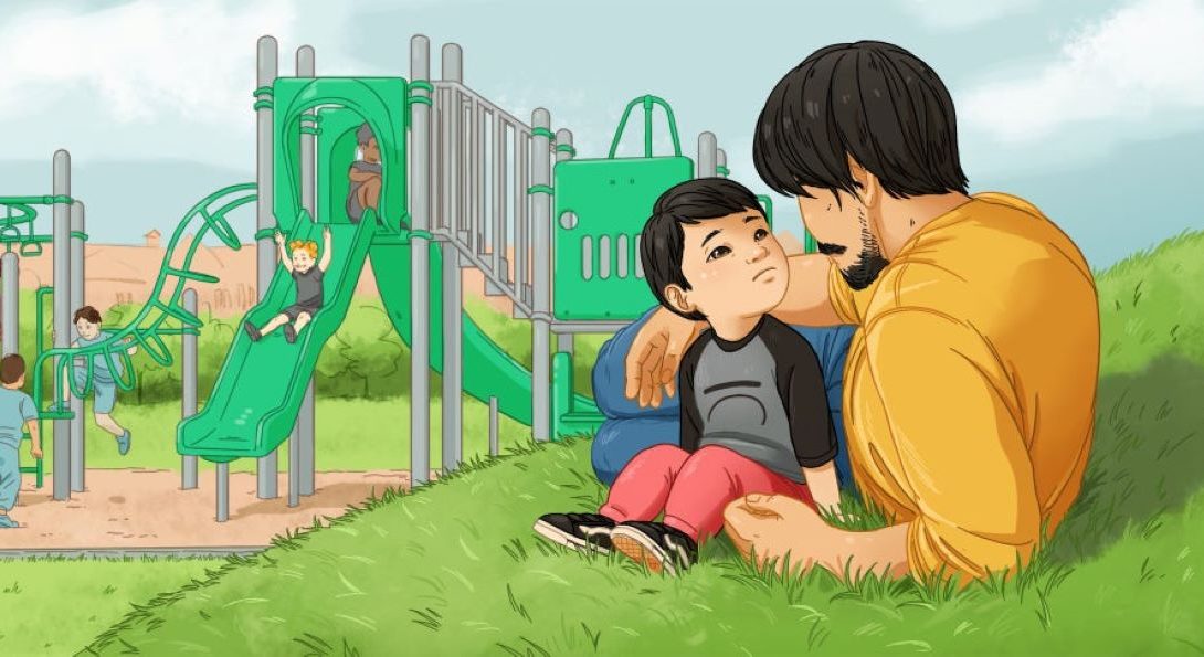 A father speaks to his child in front of a playground